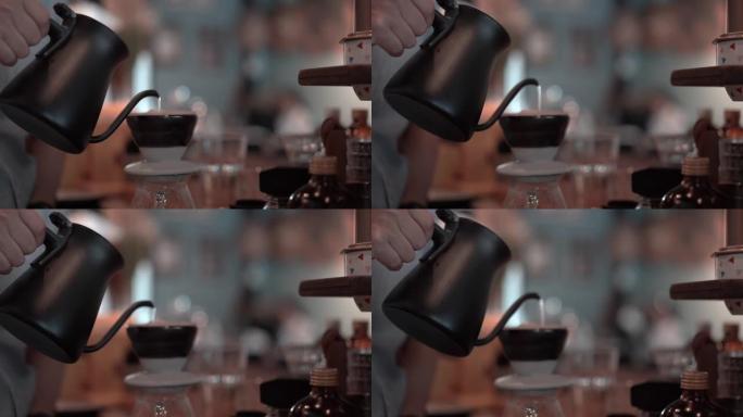 咖啡师将热水倒在陶瓷滴头的咖啡粉上，家庭酿造过程