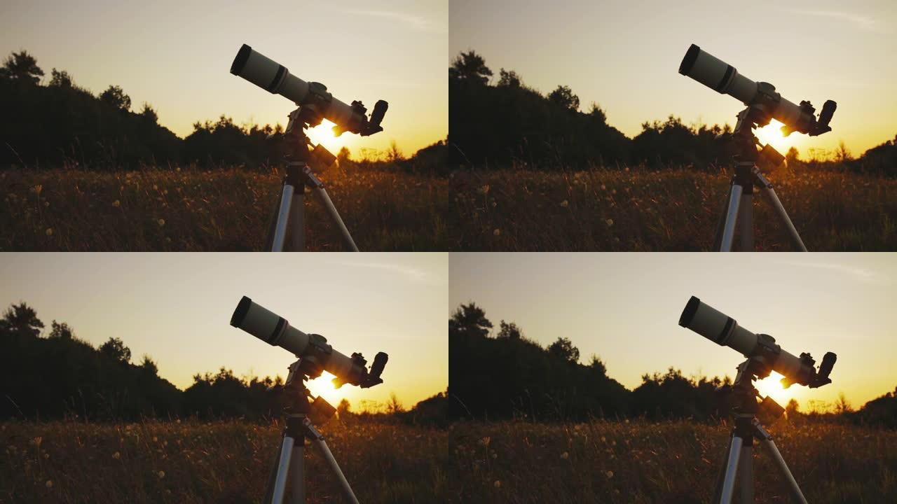 在乡村景观的日落/日出天空上的望远镜剪影。