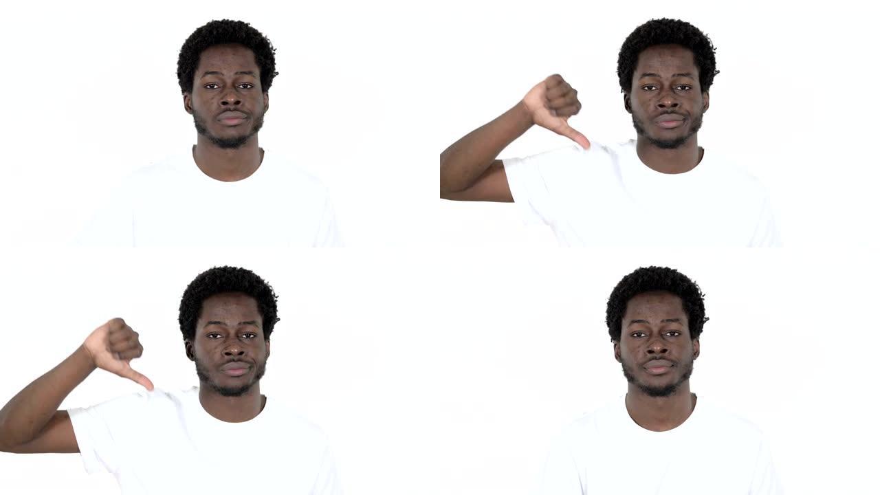 年轻的非洲男子在白色背景上示意拇指朝下
