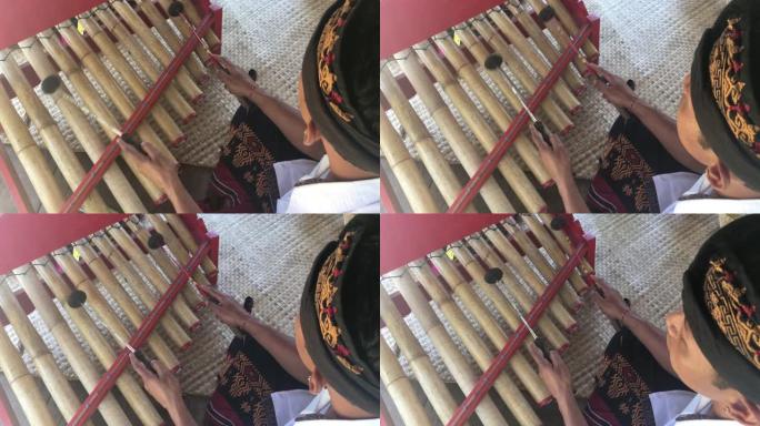 印尼男子演奏传统的甘美兰音乐