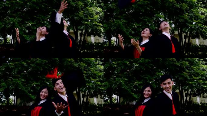 慢动作学生情侣毕业后扔快乐帽子