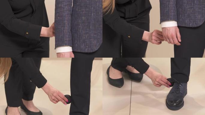 裁缝手的细节，为男性西装缝纫测量腿部。为男士定制时尚服装。