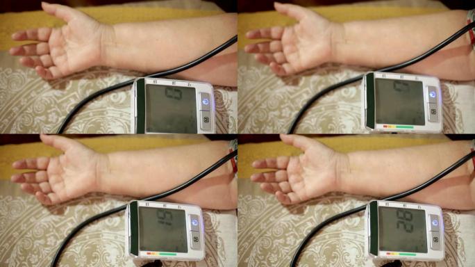 测量血压的成年女性。成年后的医疗保健