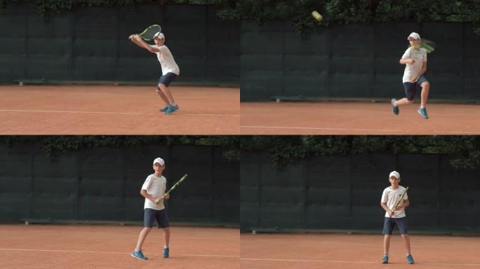 打网球，坚定的运动员少年专注于比赛，在红色的场地上拍球