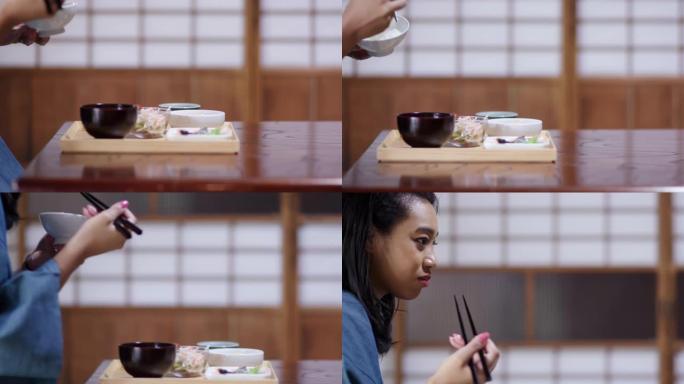 在日式旅馆中吃传统日本午餐的游客特写