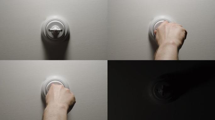 灯熄灭-男性手关闭白色墙壁上的按钮