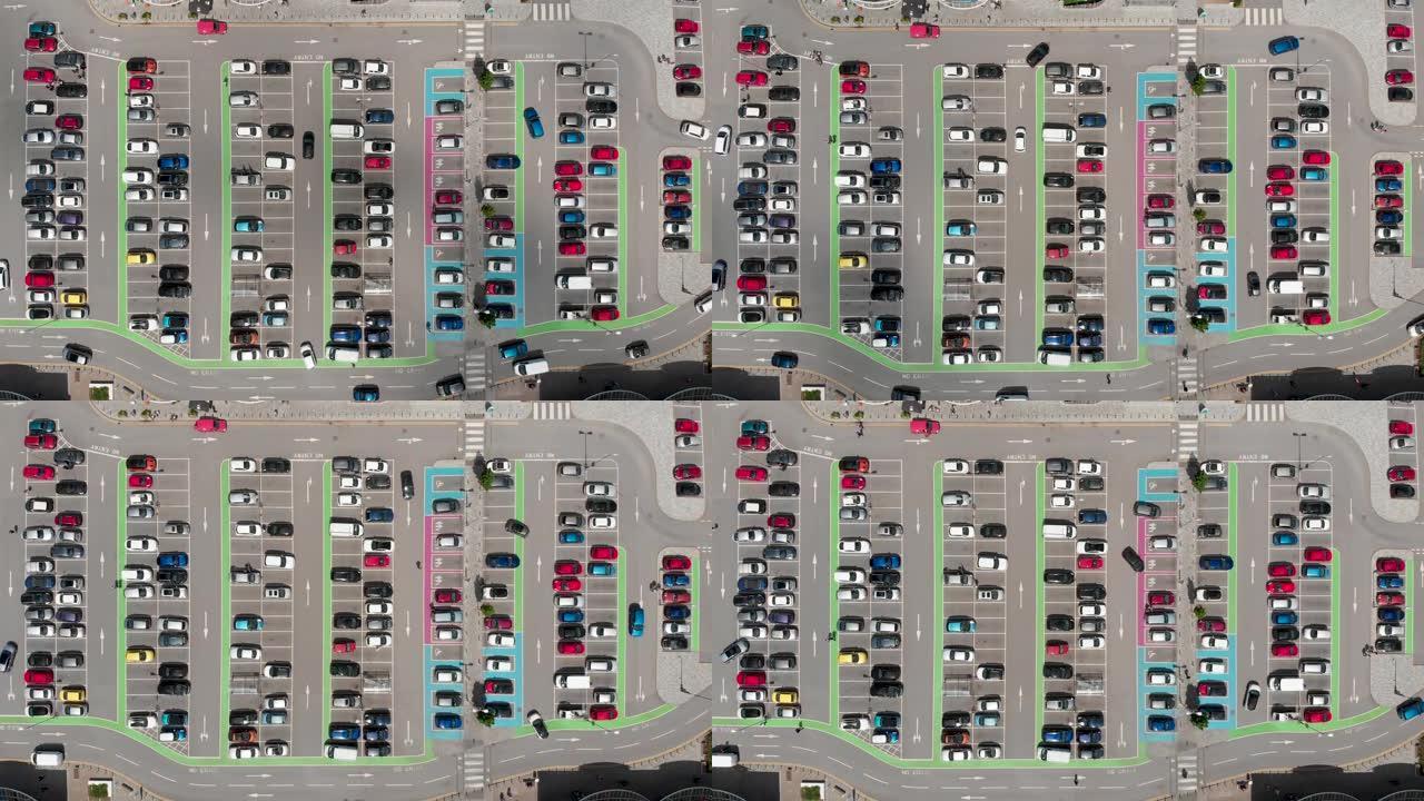 在晴朗的晴天，位于唐卡斯特西约克郡的一个繁忙的停车场的航拍画面，停车场周围有停车场和开车。