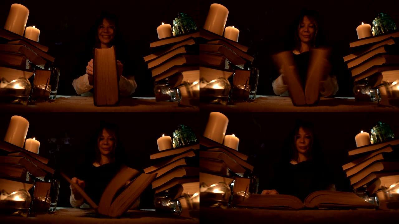 一个无聊的女孩魔术师在烛光下的黑暗房间里的特写镜头涉猎一本书和冥想。