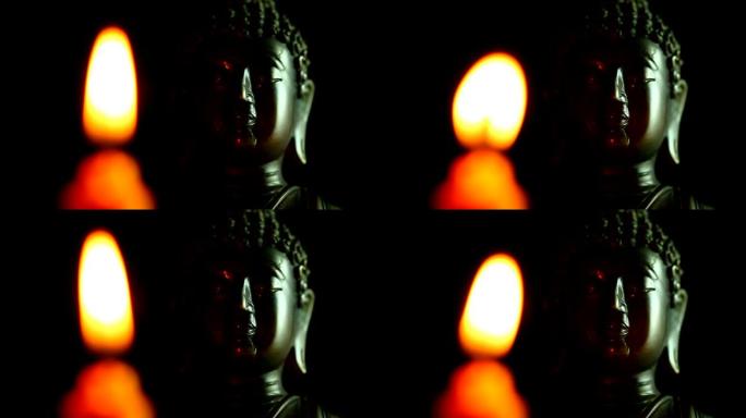 黑暗中的佛像和蜡烛