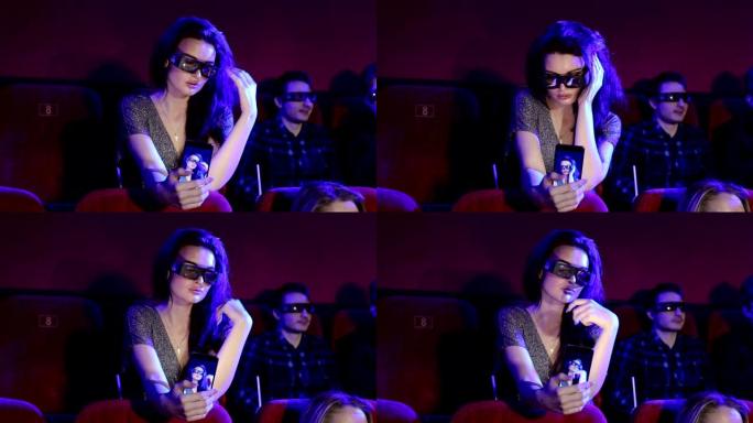 穿着3D眼镜的性感年轻女孩在电影院自拍。