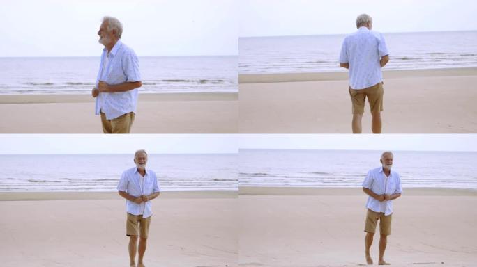 肖像老人在海滩上散步