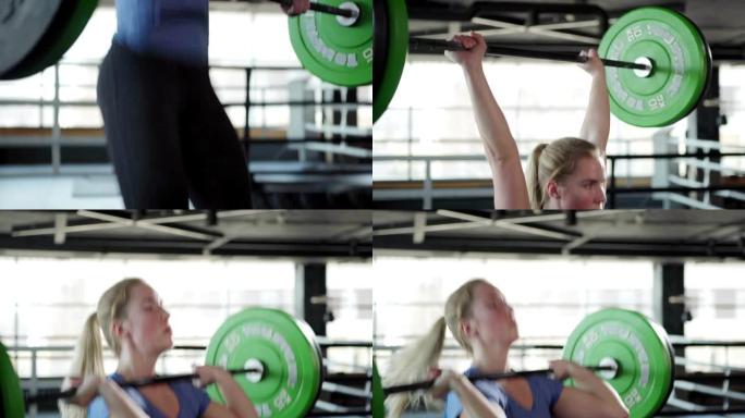 在健身房里，强壮的女运动员用盘子举起杠铃，做挺举运动