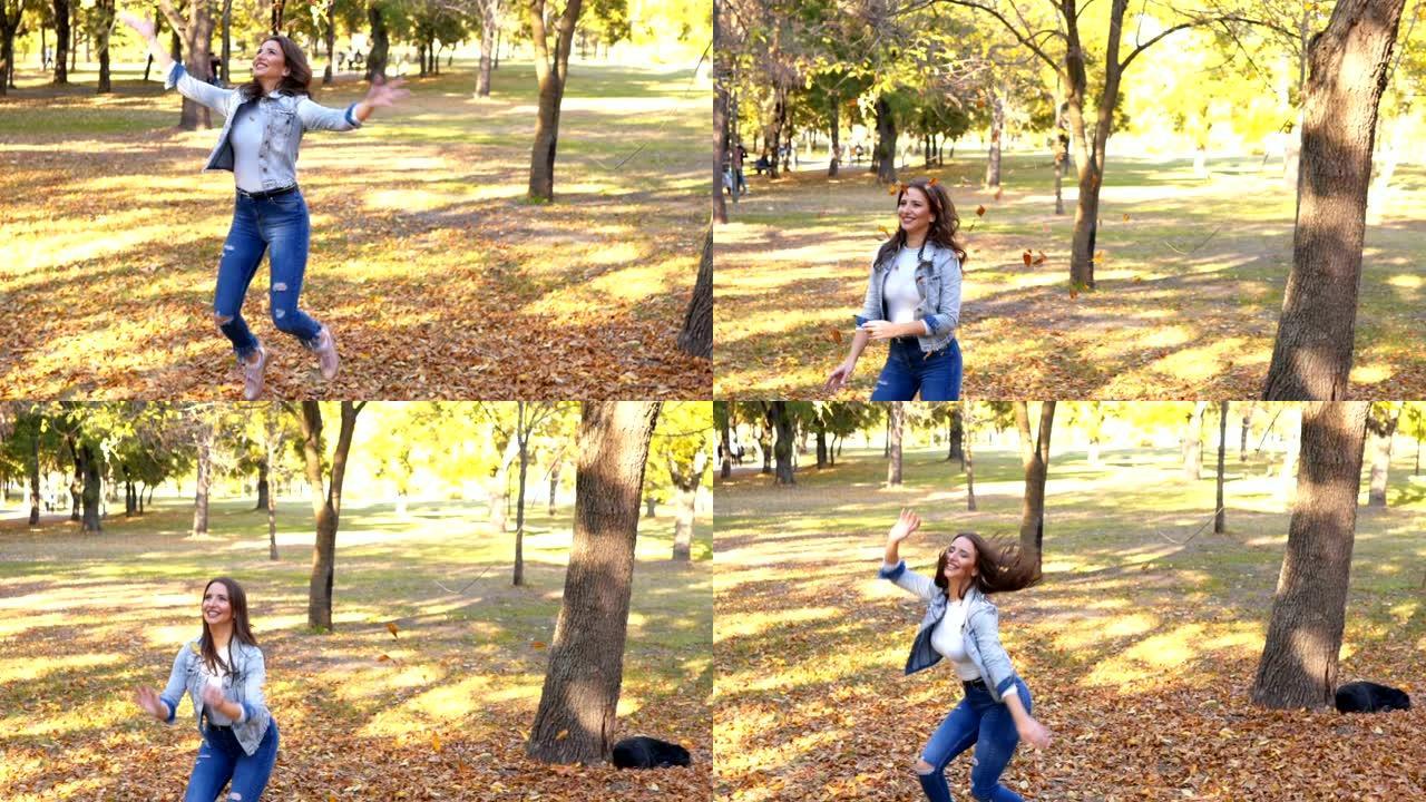 女人跳着扔秋叶