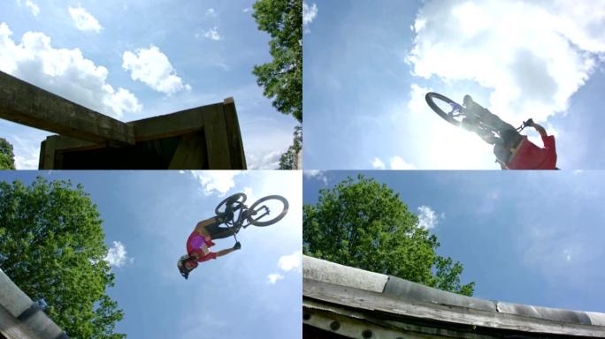 骑自行车的人在慢动作的大跳跃中做了一个超棒的后空翻技巧