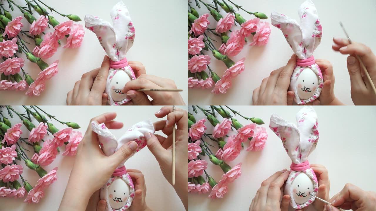 妇女和儿童的手握着为复活节兔子装饰的鸡蛋，用粉红色的脸颊刷彩蛋。