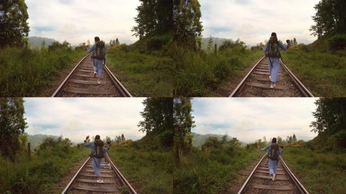 4k女人走在铁路上跳舞
