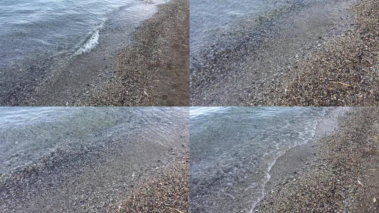 海浪卷起小砾石