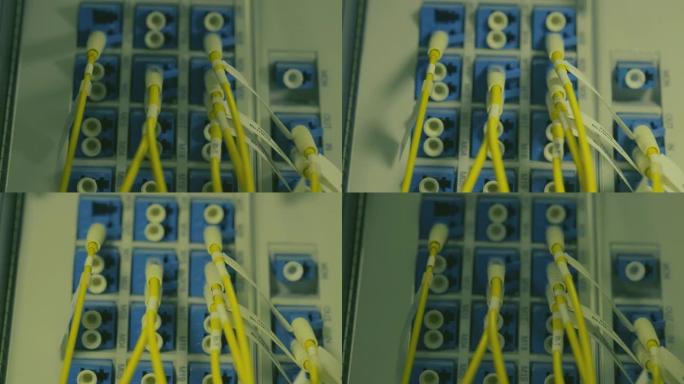 光影移动。模块端口上的光缆。用于数据中心机房高速网络的网络千兆交换机。