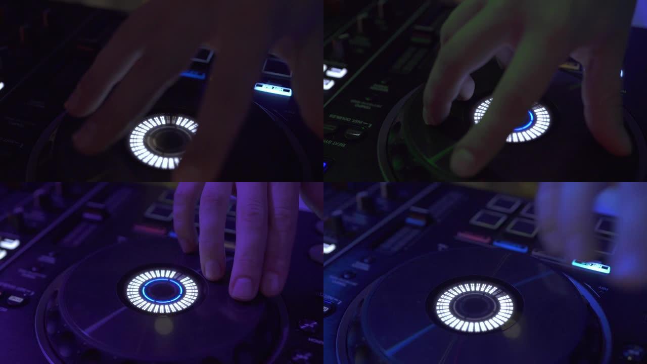 在夜总会派对上，Dj在五颜六色的灯光下在调音台上播放音乐。迪斯科派对的DJ混音器和音乐控制台。彩色照