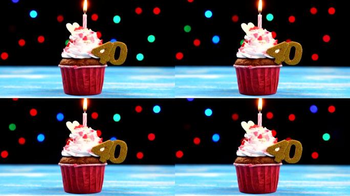 美味的生日蛋糕，蜡烛燃烧，彩色模糊灯光背景上有40号