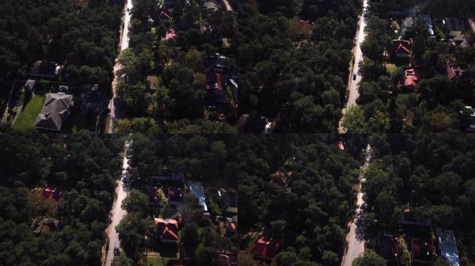 鸟瞰图飞越道路两车道森林道路，汽车货车移动茂密树林的绿树，两侧生长-无人机四直升机鸟瞰从上方透视