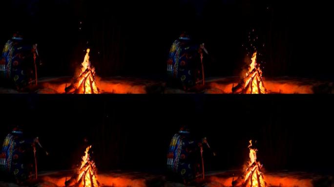 萨满在夜晚的篝火旁进行仪式