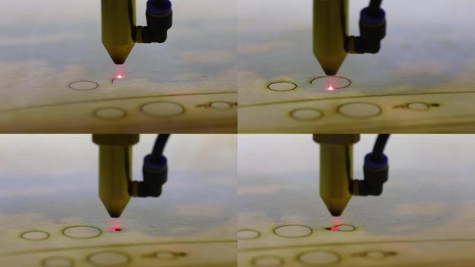 在激光数控机床中创建木制零件的过程，通过数控机床从树上切割零件。红色激光切割木板