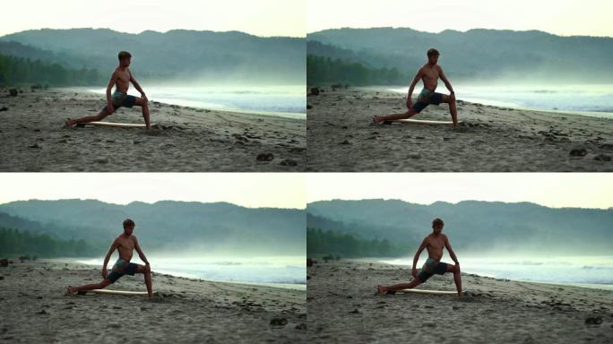 男性千禧一代做瑜伽伸展健身。肌肉健康的男人在日出时在海滩练习瑜伽