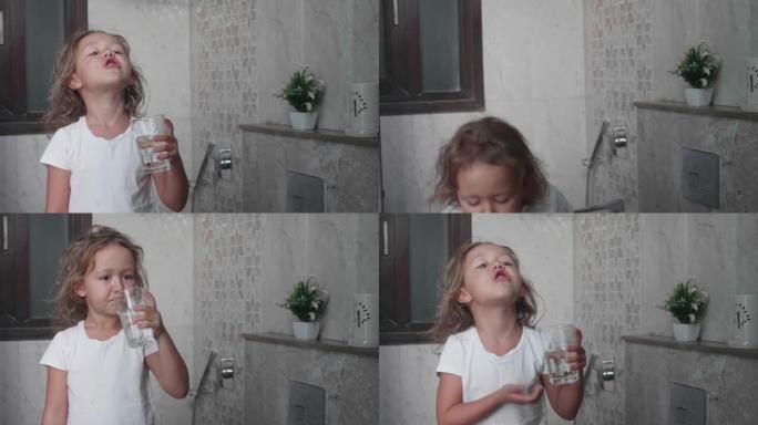 卷曲的小女孩用水漱口。