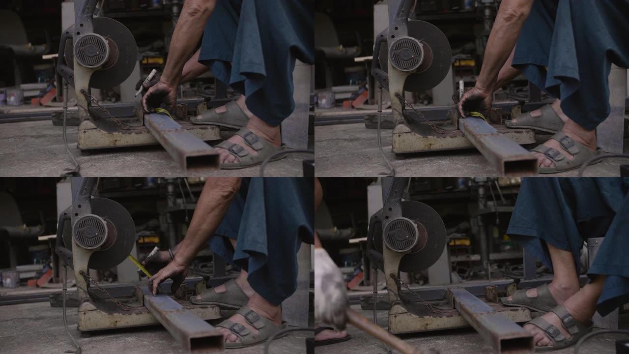 年长的男性正在准备一些用于切割钢材的钢材。