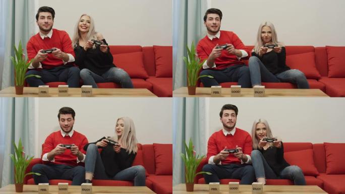 年轻夫妇一起玩电子游戏