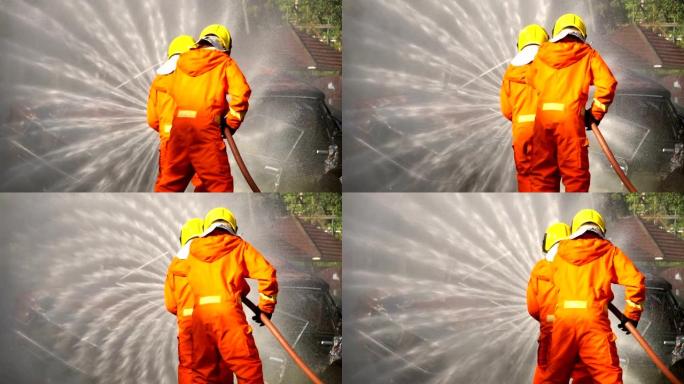 消防人员使用消防水带灭火-慢动作