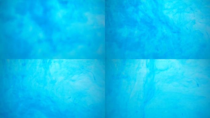 浅蓝色染料溶解在漩涡水浴中