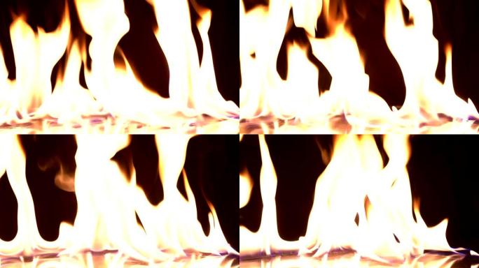 4k视频拍摄，火焰点燃燃烧。真实的火焰，黑色背景上点燃一行真实的火焰。