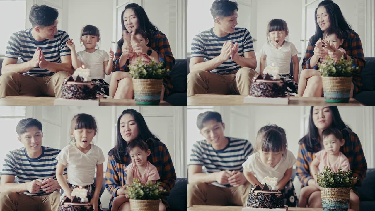亚洲家庭在客厅庆祝年轻女儿生日 (慢动作)