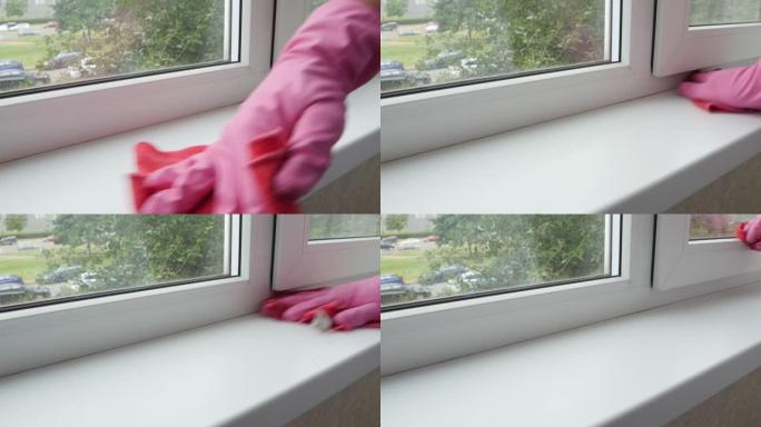 用橡胶手套清洁白色窗台