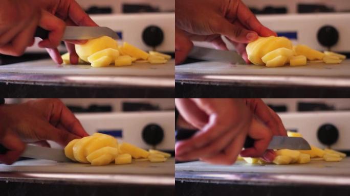 在砧板上煮切土豆。特写镜头
