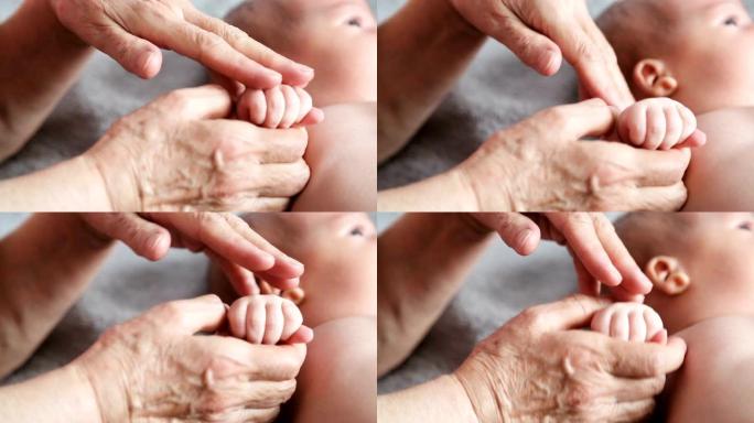 祖母握着他心爱的孙子的手