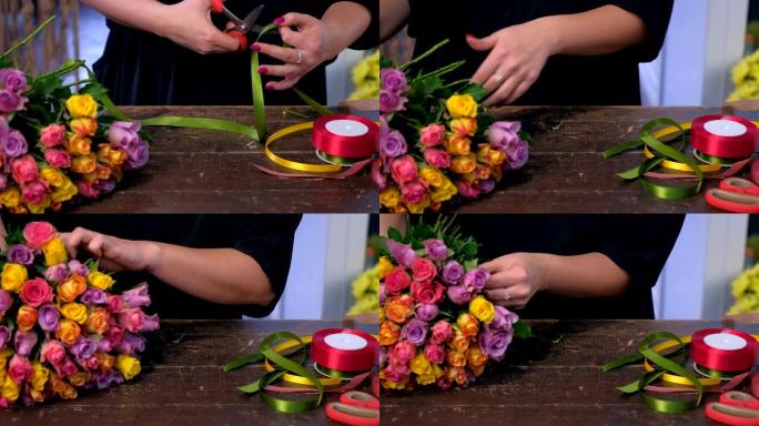 女花店工作剪彩从玫瑰，双手特写。