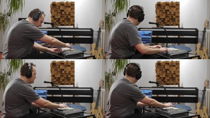 音乐家在家庭音乐工作室演奏midi键盘。