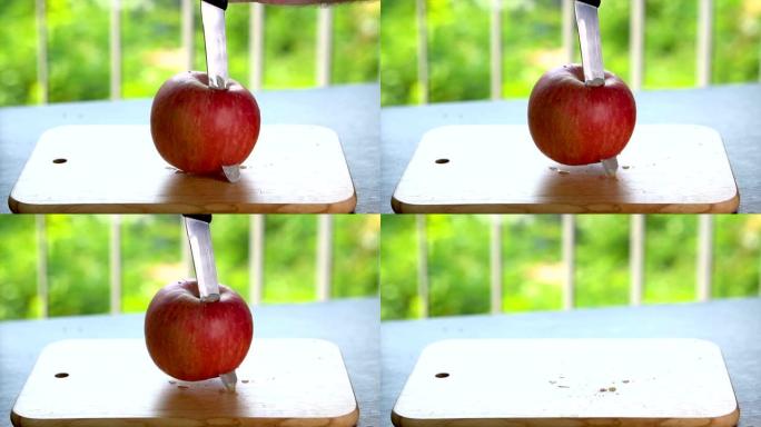 用刀子慢动作刺伤苹果