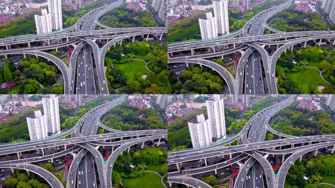 高速公路交叉口形状字母x十字的鸟瞰图。交通概念中的桥梁、道路或有树的街道。中国上海市城市建筑结构形状