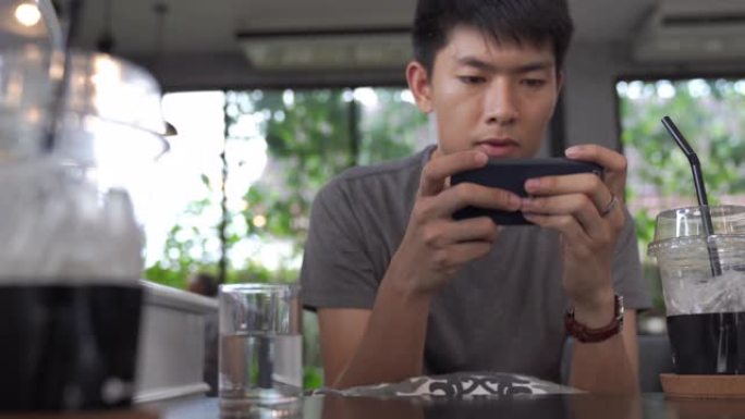 使用数字平板电脑和智能手机的年轻亚洲商人在家工作，并在职业中通过在线购物放松身心