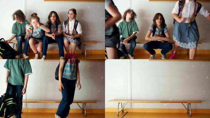 放学期间的学生坐在走廊的长椅上。突然，铃响了，孩子们站着，带着背包跑去上课