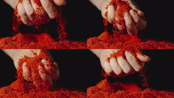 慢动作: 男人的手掌触碰并粉碎了红辣椒