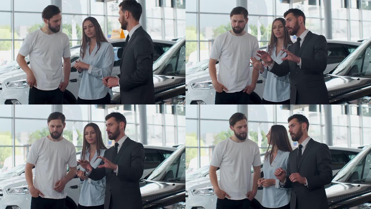 专业的汽车推销员在车展上向感兴趣的买家介绍豪华汽车，而男人和女人正在看汽车并听经销商讲话。