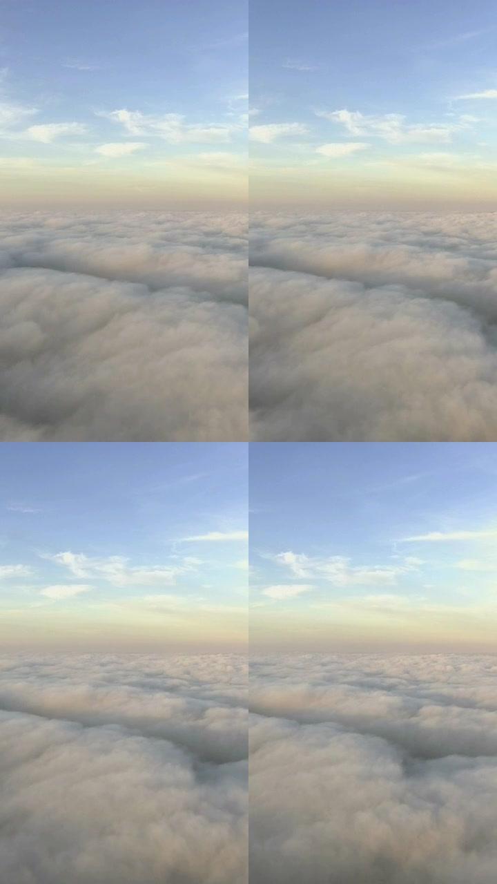 垂直视频。从飞机上看云层。飞越地球
