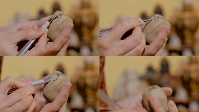 陶艺车间的女陶工制作陶瓷纪念品便士哨子