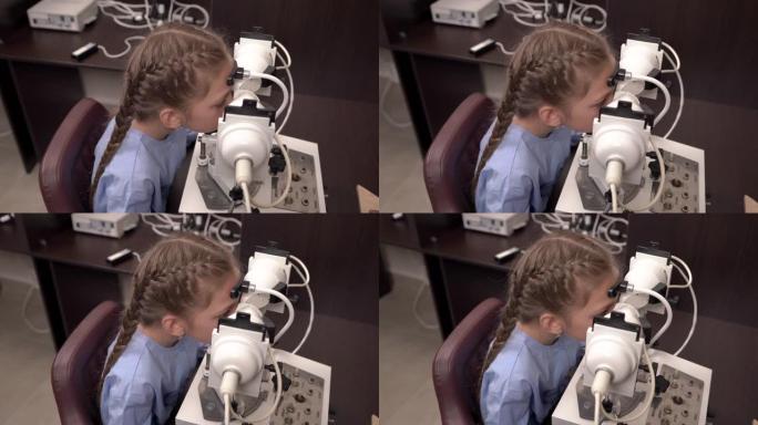 一位眼科医生使用眼科检查设备检查小女孩视力的俯视图
