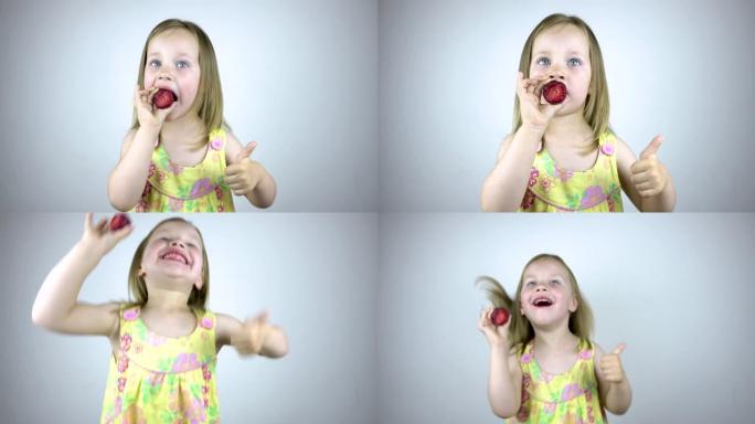 一个三岁的小女孩吃草莓，露出拇指。